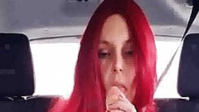Redhead milf fucking a dildo on the backseat